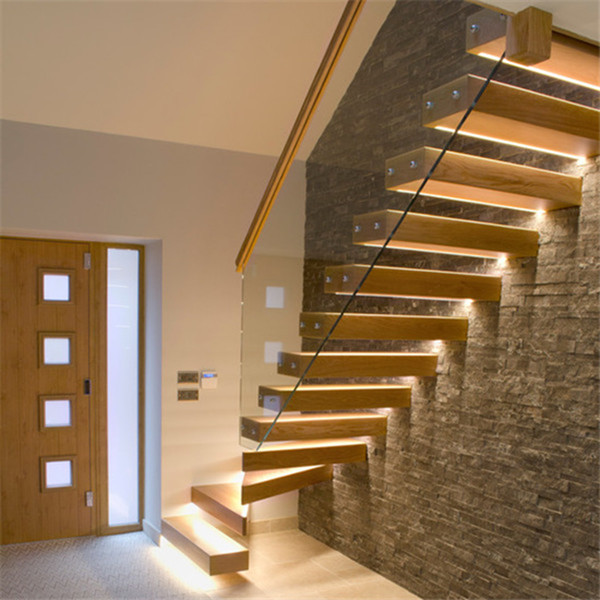 Interior floating straight staircase with wood tread and glass railing