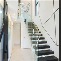 Moden style metal floating staircase with frameless glass railing